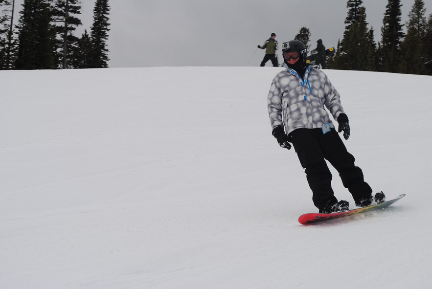 Tech. Sgt. Martin Edwards, 341st Logistics Readiness Squadron heavy equipment maintenance NCO in charge, snowboards down Sour Dough Hill Trail during Malmstrom’s final Wing Ski Day of the season at Showdown Ski Resort on March 20. Airmen participated in several activities including snowboarding, skiing and snowshoeing. (U.S. Air Force photo/Airman 1st Class Katrina Heikkinen) 