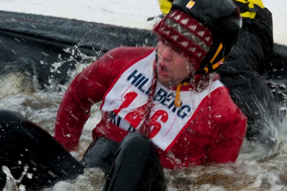 JOINT BASE ELMENDORF-RICHARDSON, Alaska ??? J.R. Wendler, a contestant in the Hillberg Slush Cup, is rescued from  the icy lake water by ski patrollers on standby at the Hillberg Ski Area March 24. Wendler crashed while attempting to ski across a manmade pond during the Slush Cup.  The Slush Cup is held annually by the Hillberg Ski Area on JBER. (U.S. Air Force photo/Airman 1st Class Omari Bernard)