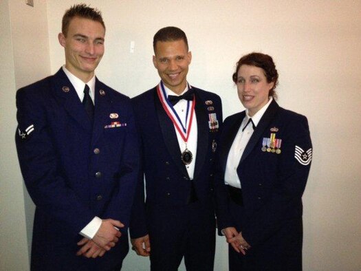 Airman 1st Class Ashton Spurr (left), 11th Logistics Readiness Squadron logistics planner, Senior Master Sgt. Edward Edgar, 319th Recruiting Squadron production superintendent and Tech. Sgt. Katherine Edgar, 844th Communication Group training manager, pose for the camera after the chief master sergeant medallion ceremony Feb. 8, 2013 at the Bolling Club, Joint Base Anacostia-Bolling, Washington, D.C. Each of the Air Force District of Washington selected chief master sergeants received a medallion and a plaque recognizing their new rank at the conclusion of their week-long seminar. (Courtesy photo)