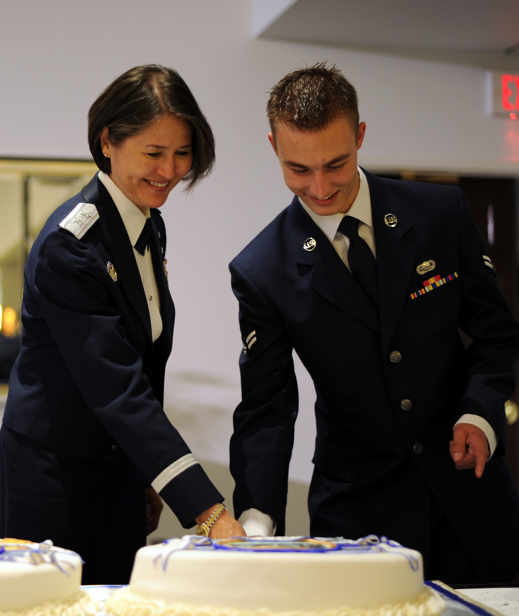 Maj. Gen. Sharon K.G. Dunbar, Air Force District of Washington commander, and Airman 1st Class Ashton Spurr, 11th Logistics Readiness Squadron logistics planner, marked the Air Force’s 65th Birthday by cutting a ceremonial cake during the Air Force Birthday Ball, Sept. 21, 2012. Traditionally, the highest and lowest ranking members in attendance team up to cut the birthday cake. (U.S. Air Force photo/Staff Sgt. Keyonna Fennell)