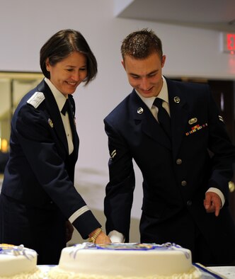 Maj. Gen. Sharon K.G. Dunbar, Air Force District of Washington commander, and Airman 1st Class Ashton Spurr, 11th Logistics Readiness Squadron logistics planner, marked the Air Force’s 65th Birthday by cutting a ceremonial cake during the Air Force Birthday Ball, Sept. 21, 2012. Traditionally, the highest and lowest ranking members in attendance team up to cut the birthday cake. (U.S. Air Force photo/Staff Sgt. Keyonna Fennell)