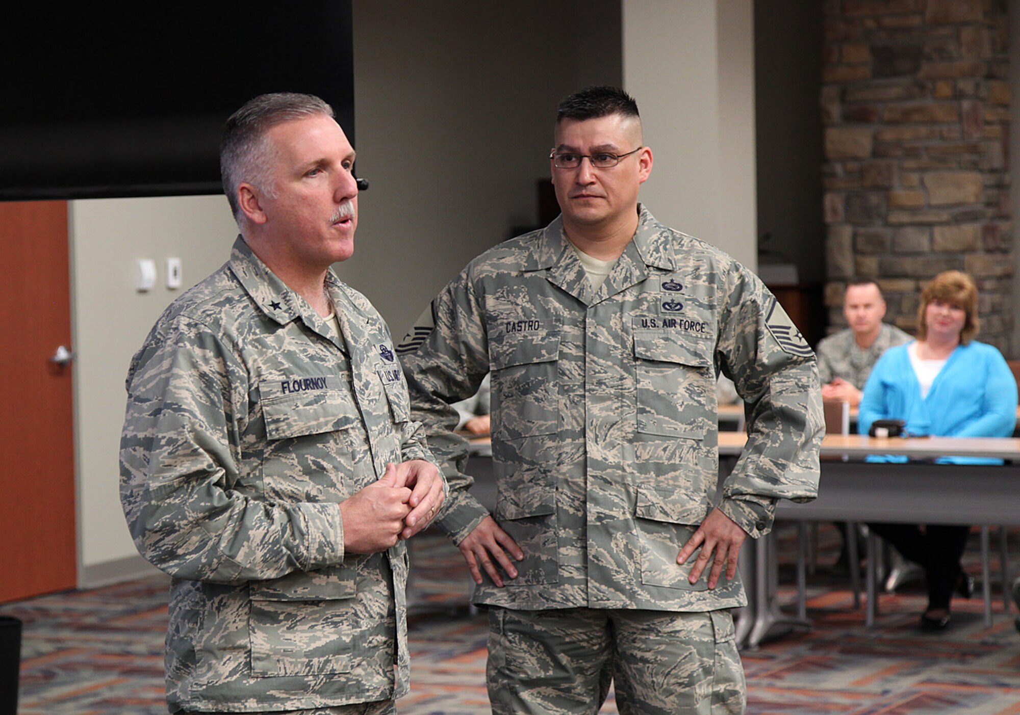 Brig. Gen. Jay Flournoy, commander of ARPC, honored Master Sgt. Javier J. Castro during a Defense Council meeting here today, a community relations event attended by more than 100 people including Aurora Chamber of Commerce members, congressional staffers, and unit commanders. Castro won Outstanding Airman of the Year at the Air Force Reserve Command-local board level. He will go on to compete at the Air Force Reserve Command-level. (U.S. Air Force photo/Quinn Jacobson)