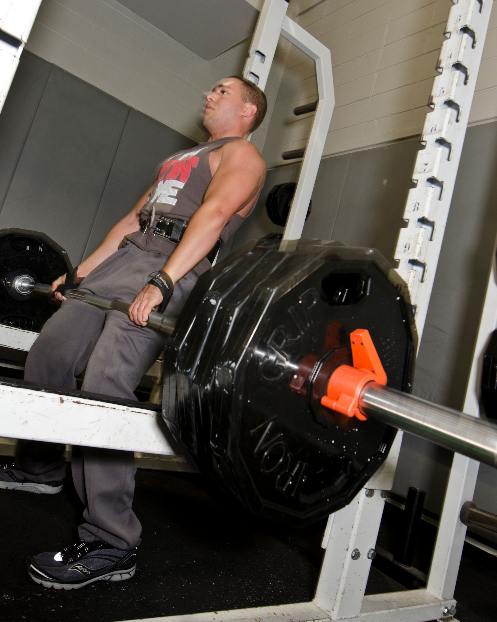 Senior Airman Kenneth Noel, an electronic warfare technician of the 1st Special Operations Component Maintenance Squadron, lifts weights at the Aderholt Fitness Center at Hurlburt Field, Fla., March 27, 2013. The 24-hour manning is available for Airmen who work odd hours. (U.S Air Force Photo/Staff Sgt. John Bainter) 