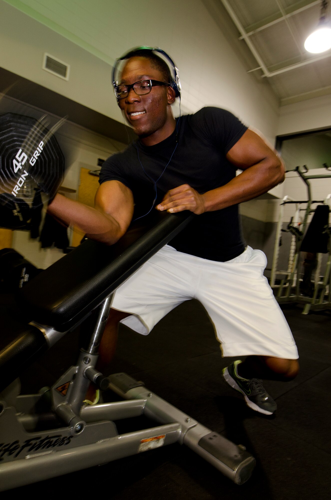 Airman 1st Class Cameron Jackson, a Tactical Air Control Party candidate exercises at the Aderholt Fitness Center at Hurlburt Field, Fla., March 27, 2013. The month-long 24-hour manning test is set to gauge Airmen’s utilization of the facility during the expanded hours. (U.S. Air Force Photo/Staff Sgt. John Bainter)