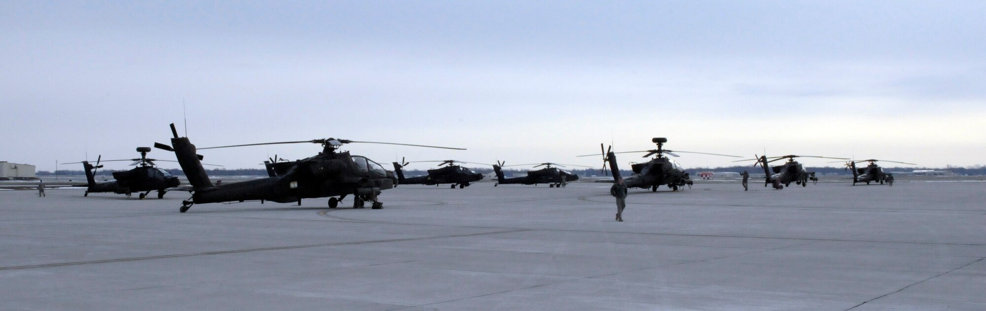 U.S. Army Ah-64 Apache Longbows from the 1-135th Attack Reconnaissance Battalion at Whiteman Air Force Base, Mo., prepare March 27, 2013, for their deployment to Afghanistan. The aircraft will stop in Texas for more training before making their way to Afghanistan. (U.S. Air Force photo by Airman 1st Class Shelby R. Orozco/Released)