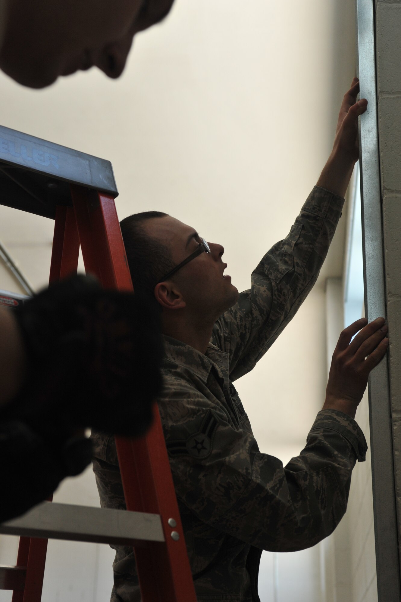 MINOT AIR FORCE BASE, N.D. -- 5th Civil Engineering Squadron members install walls for the First Sergeant's pantry. Some of the current projects The 5th CES is working hard on include Darbyland at Roughriders Pizza and creating a space for the First Sergeants Pantry inside of Treasure Island. (U.S Air Force photo/Senior Airman Jose L. Hernandez)