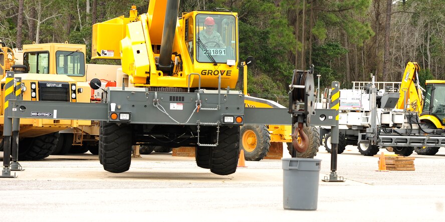 U.S. Air Force Tech. Sgt. Robert Lombardo, a heavy equipment operator for 823rd RED HORSE Squadron, practices using a crane in preparation for Exercise New Horizons on Hurlburt Field, Fla., March 20, 2013. The last of nearly 100 Airmen from 823rd RED HORSE departed Hurlburt Field for Belize, Central America to build schools, showers and other structures during the exercise. (U.S. Air Force Photo by Senior Airman Kentavist P. Brackin)
