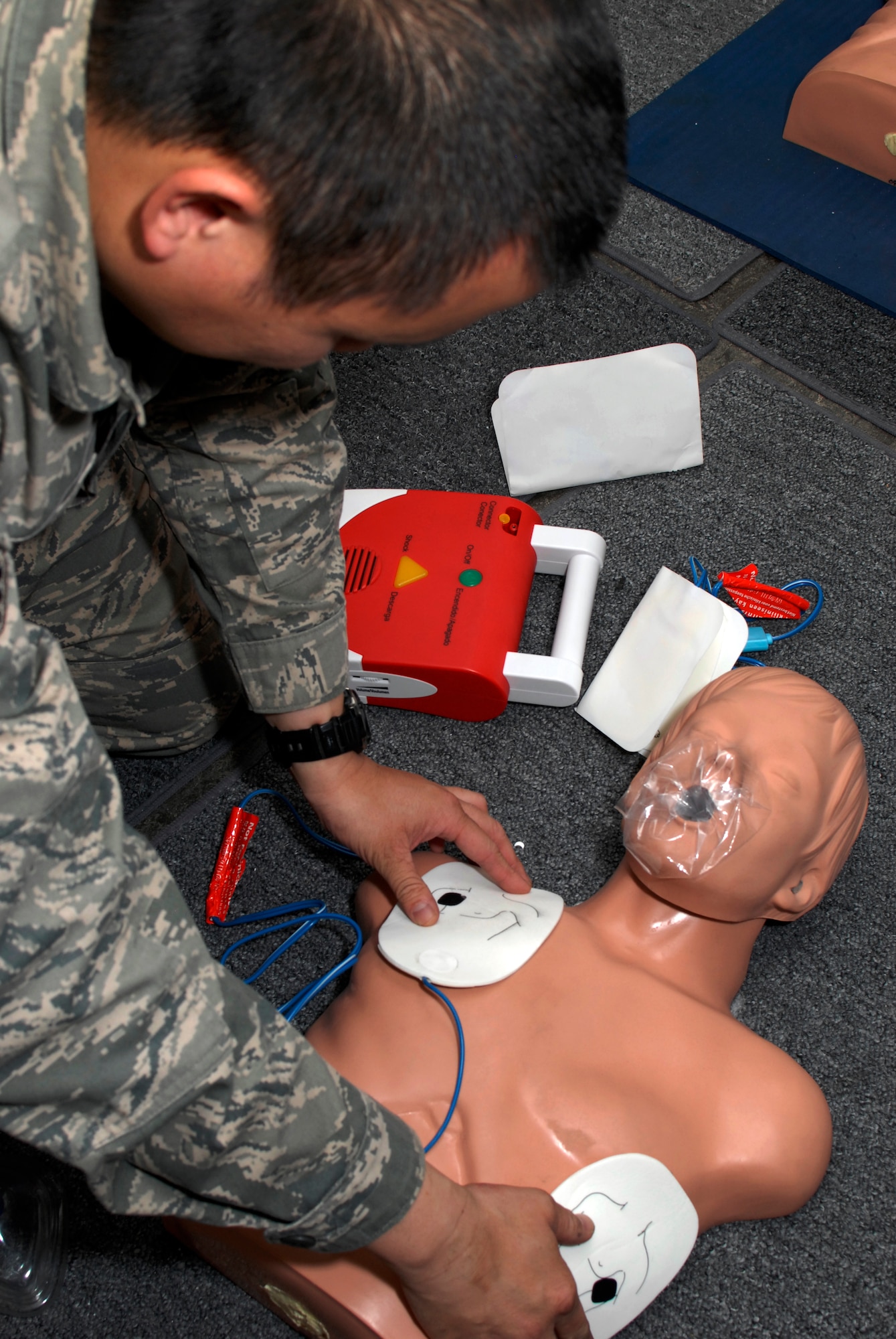 California Air National Guard Senior Airman Leonard Tran, utilizes an automated external defibrillator (AED) during CPR training, at Moffett Federal Airfield, Calif., Feb. 10, 2013. According to the American Red Cross an AED is the only effective treatment for restoring an irregular heart rhythm during sudden cardiac arrest. (Air National Guard photo by Staff Sgt. Kim E. Ramirez)