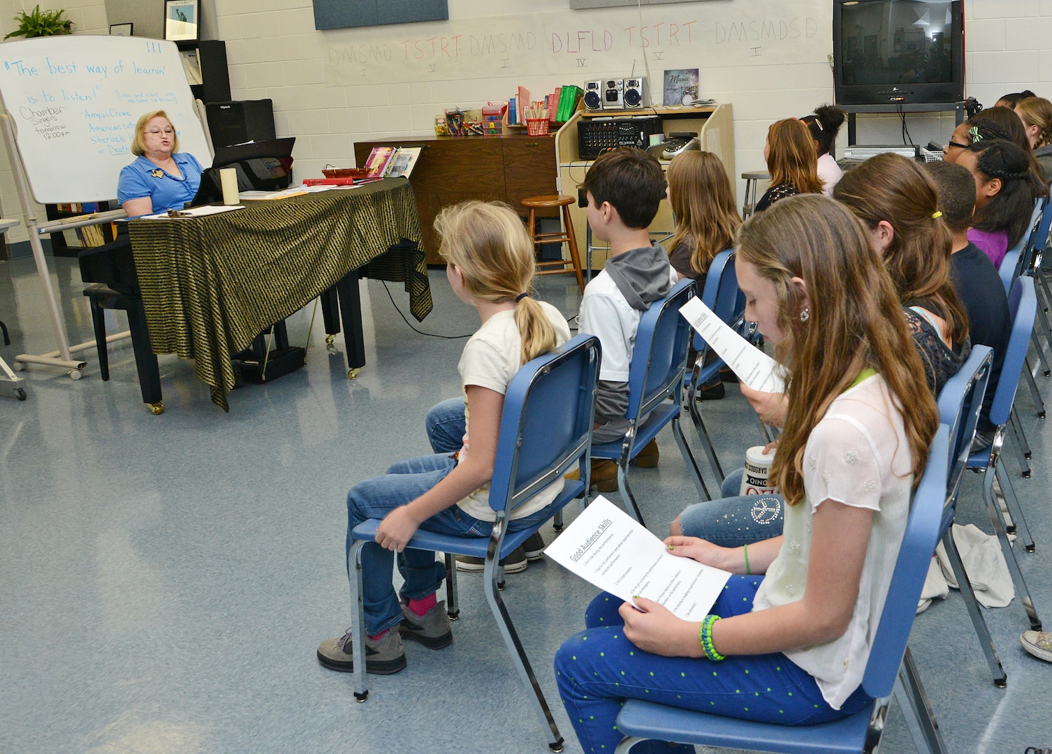 Joyce Sullivan, Randolph Middle School choir director, rehearses songs with her sixth grade choir class March 21 at Joint Base San Antonio-Randolph. (U.S. Air Force photo by Benjamin Faske/ Released)