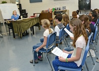 Joyce Sullivan, Randolph Middle School choir director, rehearses songs with her sixth grade choir class March 21 at Joint Base San Antonio-Randolph. (U.S. Air Force photo by Benjamin Faske/ Released)
