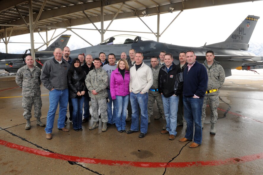 As part of a tour of the 388th Fighter Wing, honorary commanders and their guests paid a visit to the flightline to see an F-16 up close at Hill Air Force Base, Utah, March 21. U.S. Air Force Col. Scott Long, the 388th FW commander, hosted the tour of the wing and its operations and maintenance groups. (U.S. Air Force photo by Alex Lloyd/Released)