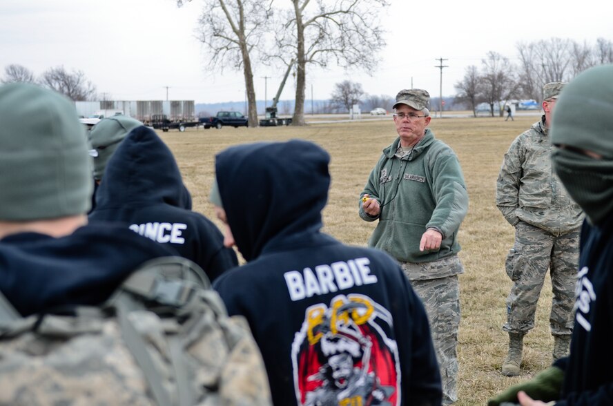 Chief Master Sgt. Steven Hampton, 139th Maintenance Squadron, records time during the 7th annual Raider Challenge hosted by the 139th Airlift Wing at Rosecrans Air National Guard Base, St. Joseph, Mo., March 23, 2013. Hampton helped facilitate the more than 150 JROTC cadets to compete in the event. (Air National Guard photo by Tech. Sgt. Michael Crane)