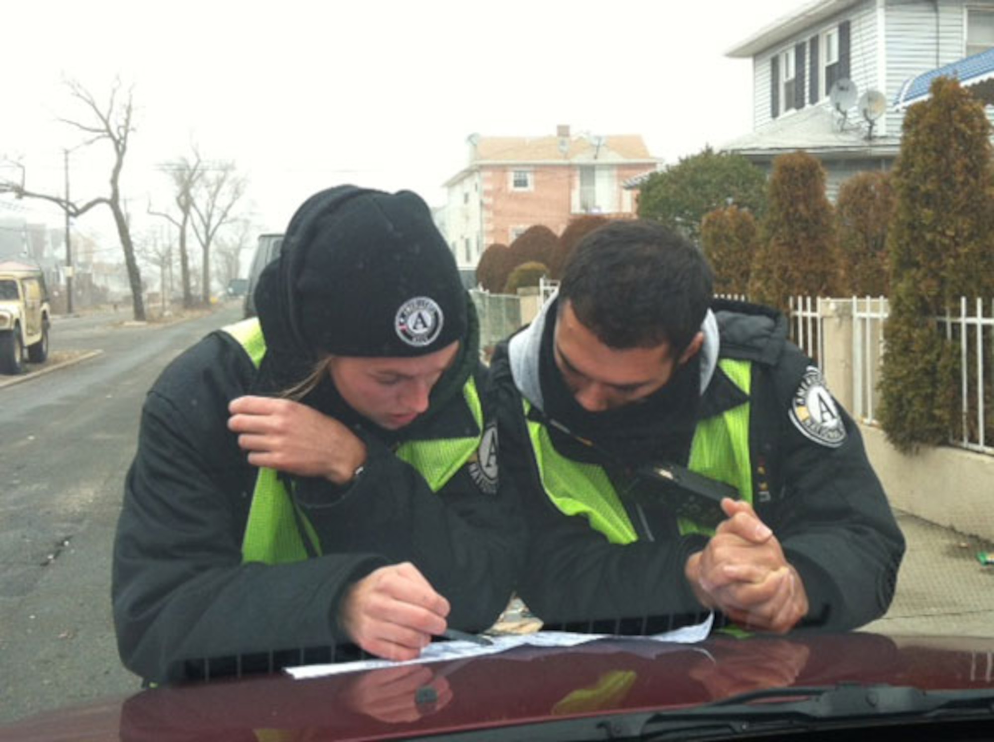 AmeriCorps members Diana Feldmann and Gabriel Galdamez plan for cleanup in Far Rockaway, NY. [Photo Courtesy of AmeriCorps]