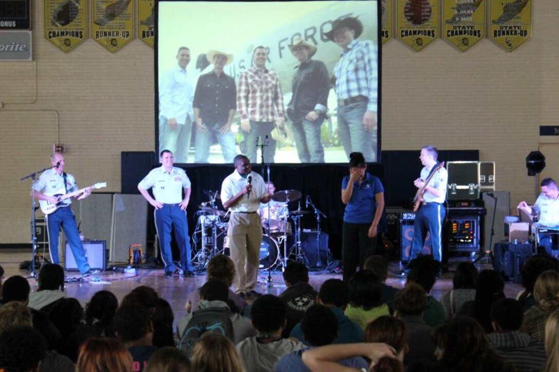 2nd Lt. Ariez Waiters speaks to students between songs with Wild Blue
Country at Lusher Charter School in New Orelans.  (US. Air Force Photo by MSgt Michael Riley)