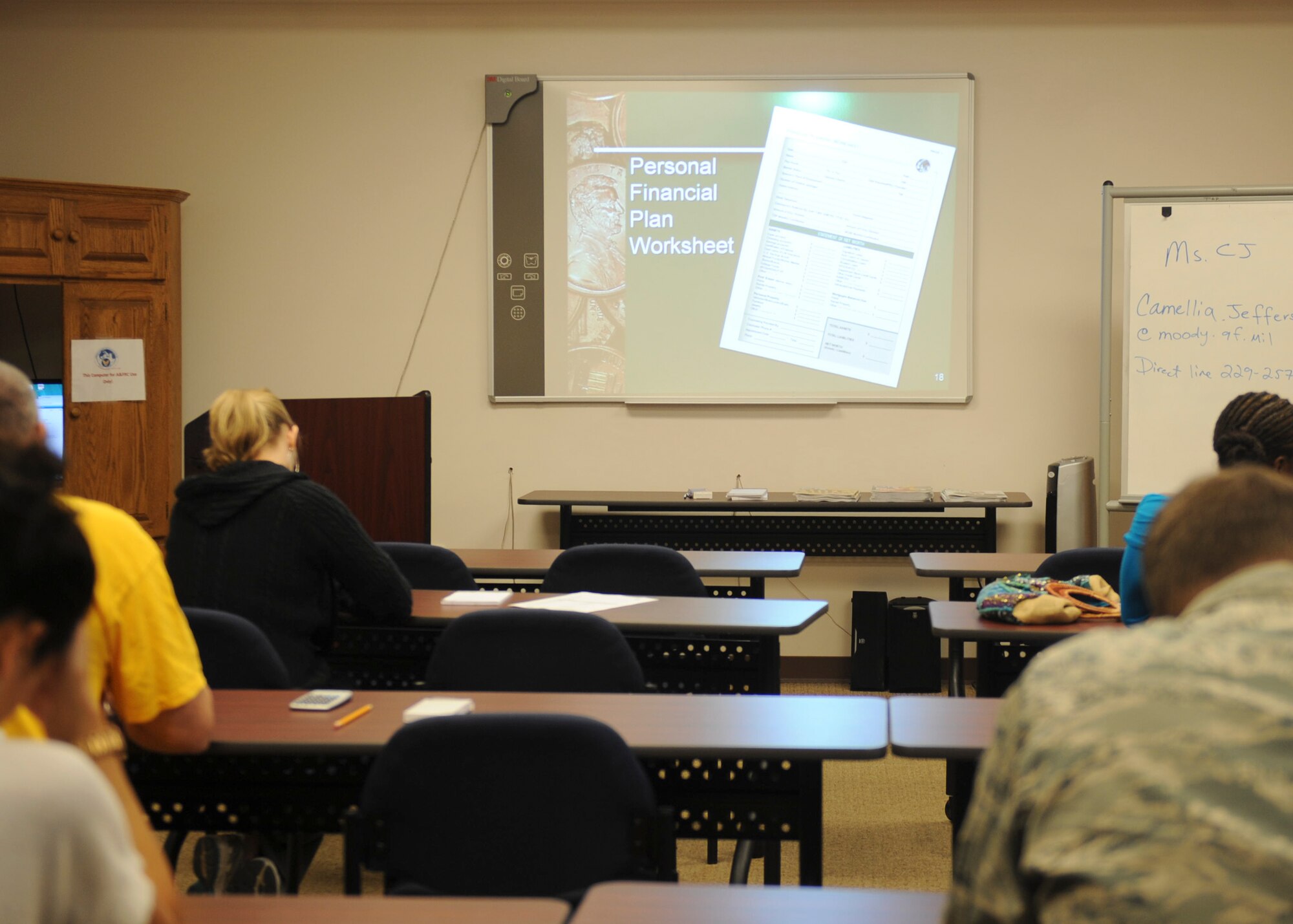 The Airman and Family Readiness Center hosts a Financial Lunch and Learn at Moody Air Force Base, Ga., March 21, 2013. The lunch and learn taught students how to spend and save wisely to avoid debt. (U.S. Air Force photo by Airman 1st Class Olivia Bumpers/Released)