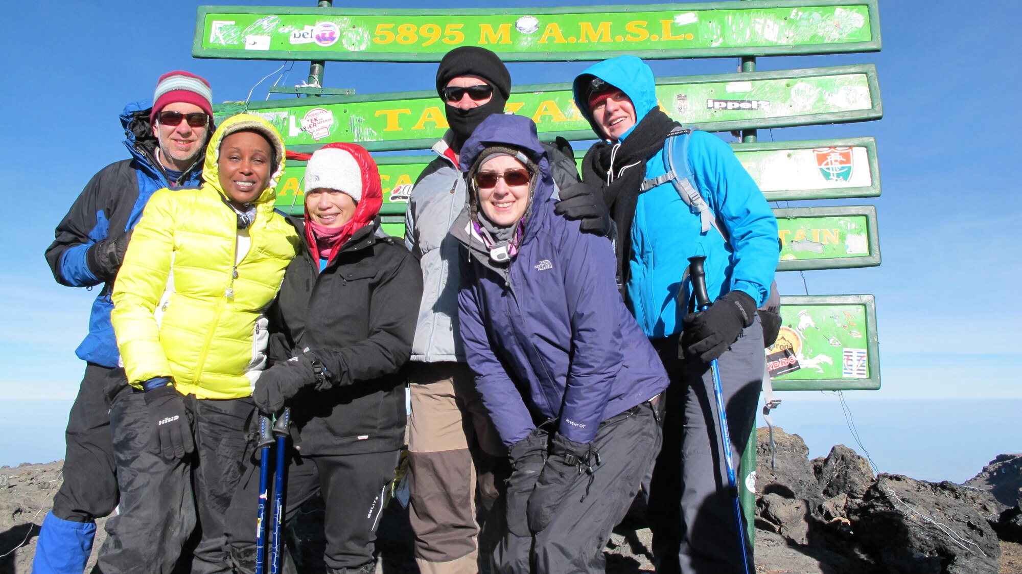 1st Lt. Diana Wong, third from left, assigned to the 509th Force Support Squadron at Whiteman Air Force Base, Mo., poses with part of her group after they reach the summit of Mount Kilimanjaro in Tanzania, Feb. 14, 2013. The group of 10 climbers was accompanied by local guides, a chef and porters who carried their gear. (Courtesy photo/Released)