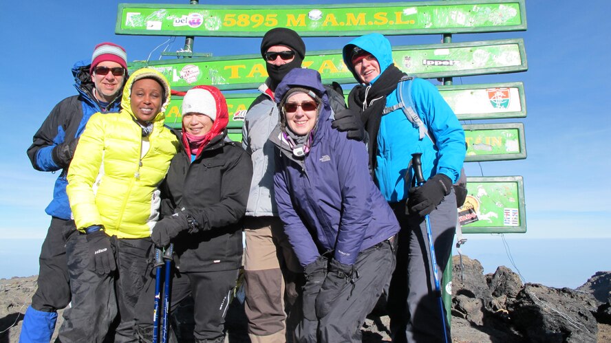 1st Lt. Diana Wong, third from left, assigned to the 509th Force Support Squadron at Whiteman Air Force Base, Mo., poses with part of her group after they reach the summit of Mount Kilimanjaro in Tanzania, Feb. 14, 2013. The group of 10 climbers was accompanied by local guides, a chef and porters who carried their gear. (Courtesy photo/Released)