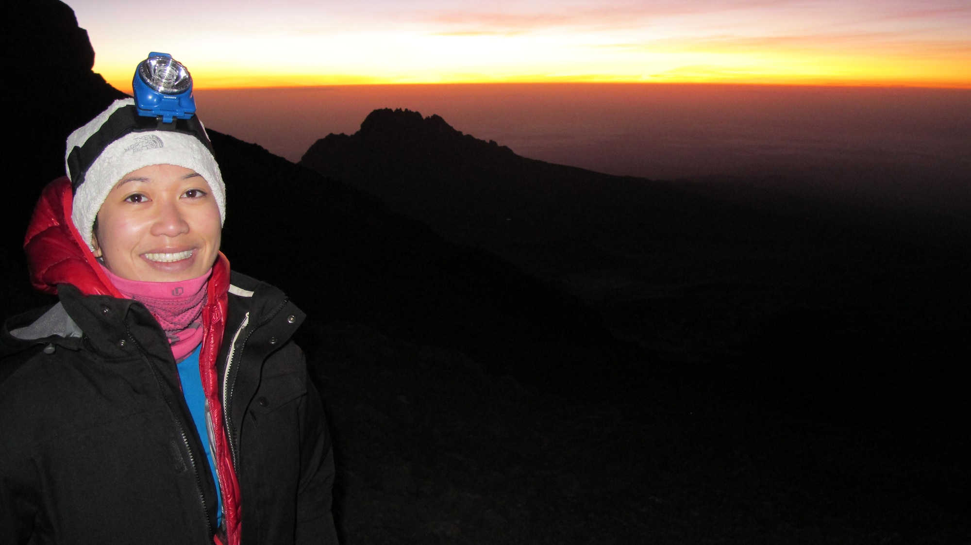 1st Lt. Diana Wong, assigned to the 509th Force Support Squadron at Whiteman Air Force Base, Mo., takes a moment to appreciate the sunrise on Mount Kilimanjaro in Tanzania, Feb. 11, 2013. On the last day of the hike, the group set off at 11:30 p.m. to make it to the peak nine hours later to catch the view. (Courtesy photo/Released)