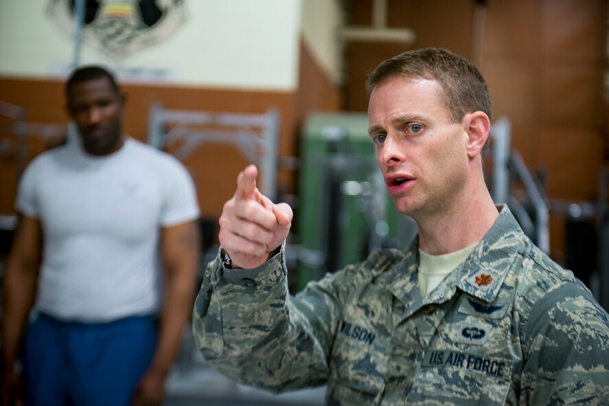 U.S. Air Force Maj. Jon Wilson, 93d Air Ground Operations Wing director of human performance, gives test instructions during a fitness assessment March 22, 2013, at Moody Air Force Base, Ga. Wilson uses fitness assessments to determine fitness programs for Airmen with specific physical goals or Airmen struggling with their physical training. (U.S. Air Force photo by Staff Sgt. Jamal D. Sutter/Released)   