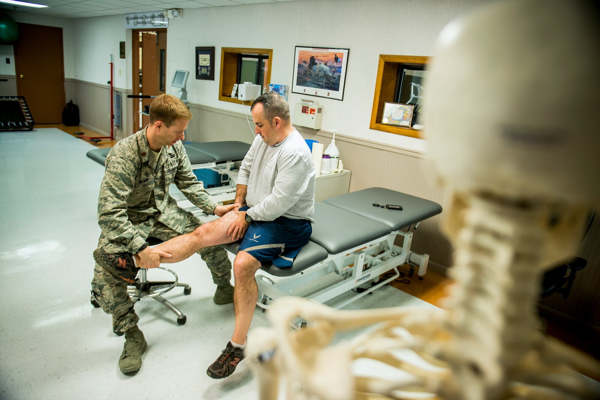 U.S. Air Force Maj. Jon Wilson, 93d Air Ground Operations Wing director of human performance, assesses the right leg of Tech. Sgt. Jasen Brouillette, 820th Combat Operations Squadron assistant innovative combat equipment NCO, Jan. 9, 2013, at Moody Air Force Base, Ga. Wilson began working as the 93d AGOW physical therapist in August 2012 and is the only person in the Air Force to hold an embedded physical therapist slot in a non-special tactics unit. (U.S. Air Force photo by Staff Sgt. Jamal D. Sutter/Released)  