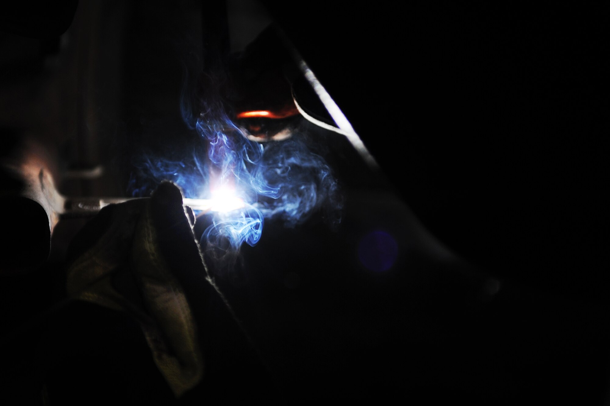 U.S. Air Force Tech. Sgt. Kevin Hokoana, 35th Maintenance Squadron fabrication flight metals technology section chief, welds a mixing duct on an engine of an F-16 Fighting Falcon at Misawa Air Base, Japan, March 27, 2013. A combination of a welding and machine shop, the metals technology section focuses on the repair and reproduction of aircraft parts. (U.S. Air Force photo by Airman 1st Class Kia Atkins)