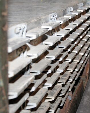 Pallets are stored ready for use in the Air Mobility Command’s airlift system March 19, 2013, at RAF Mildenhall, England. The 463L (standardized) pallets are aluminum construction and have 22 steel tie-down rings to ensure up to 10,000 pounds of cargo are secure for air transportation. (U.S. Air Force photo by Gina Randall/Released)