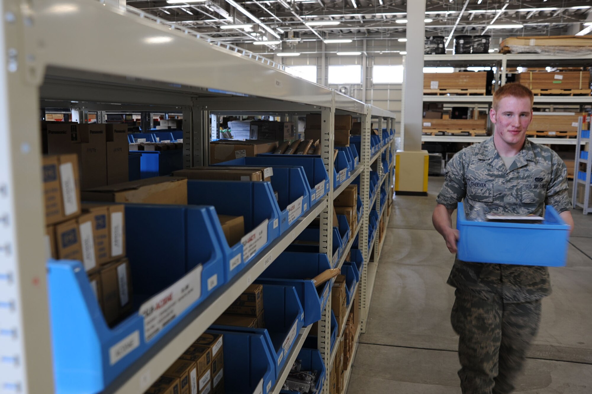 U.S. Air Force Airman 1st Class Brian Cheever, 35th Civil Engineer Squadron Operations Management, transfers material for a work order in the 35 CES supply warehouse at Misawa Air Base, Japan, March 27, 2013. Cheever is one of four Airmen who manage more than 17,000 items in the warehouse valued at $3.4 million. (U.S. Air Force photo/Senior Airman Derek VanHorn)