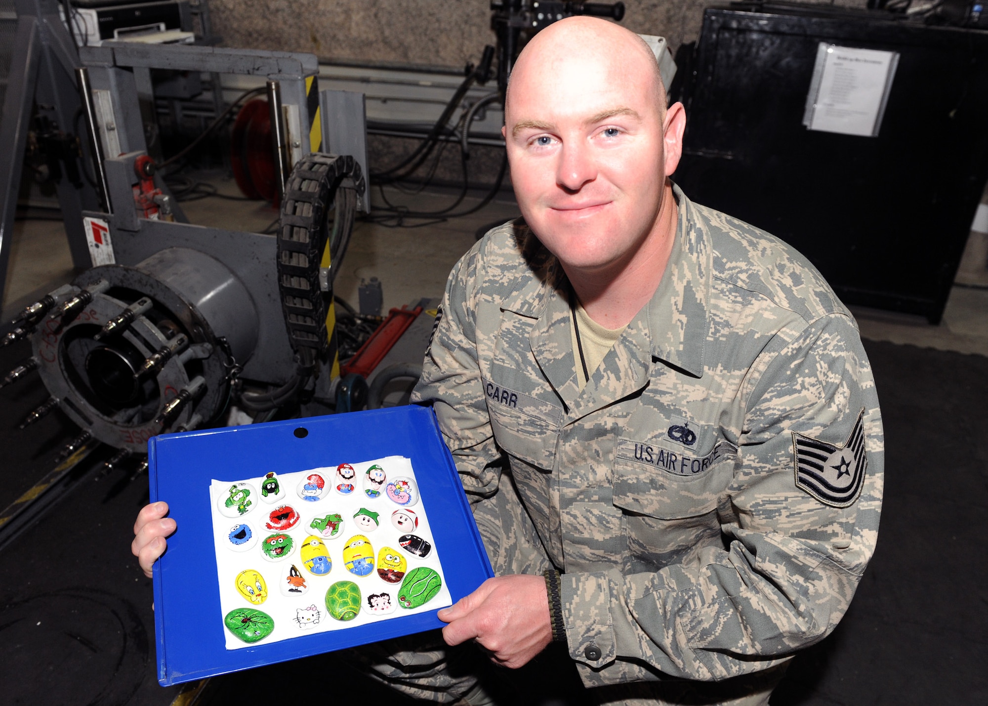 SOUTHWEST ASIA – Tech. Sgt. Christopher Carr, an aircraft battle damage repair technician with the 379th Expeditionary Maintenance Squadron, started an art collection by painting rocks found on the desert floor and leaving them for service members to improve morale. “You could pick it up and take it with you, or maybe even lay it somewhere else for someone else to kick over and find,” Carr said. “Maybe it will inspire others to do their own artwork, or leave an inspirational message if you’re not an artist.” Carr is deployed from Robins Air Force Base, Ga., and is a native of Birmingham, Ala. (U.S. Air Force photo/Senior Airman Joel Mease)