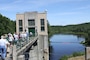 A group takes a tour of the dam gatehouse at Edward MacDowell Lake during an event celebrating the 60th anniversary of the dam's construction in July 2010.