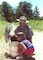 Park Ranger Jason Tremblay points out signs of life in a vernal pool to a young visitor during a pond interpretive program at Edward MacDowell Lake, Peterborough, N.H.