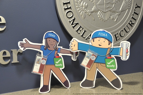 Graphic of Flat Stanley and Flat Stella's first day at FEMA underway, they take a tour of the National Response Coordination Center located at FEMA Headquarters. FEMA Photo (Brittany Trotter).