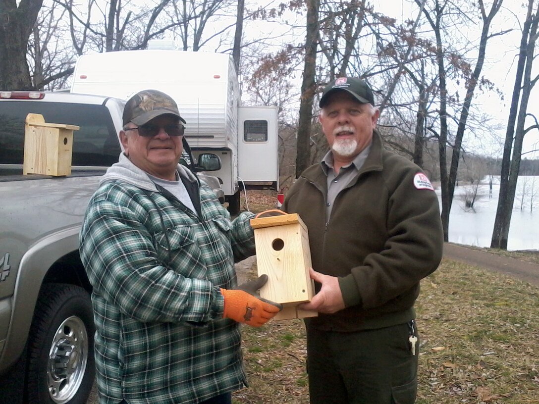 Clearwater Lake Park Ranger Don Henson (right) accepts a donation of 32 bluebird houses from a long time camper, Roy Jennings of Park Hills, Mo. 