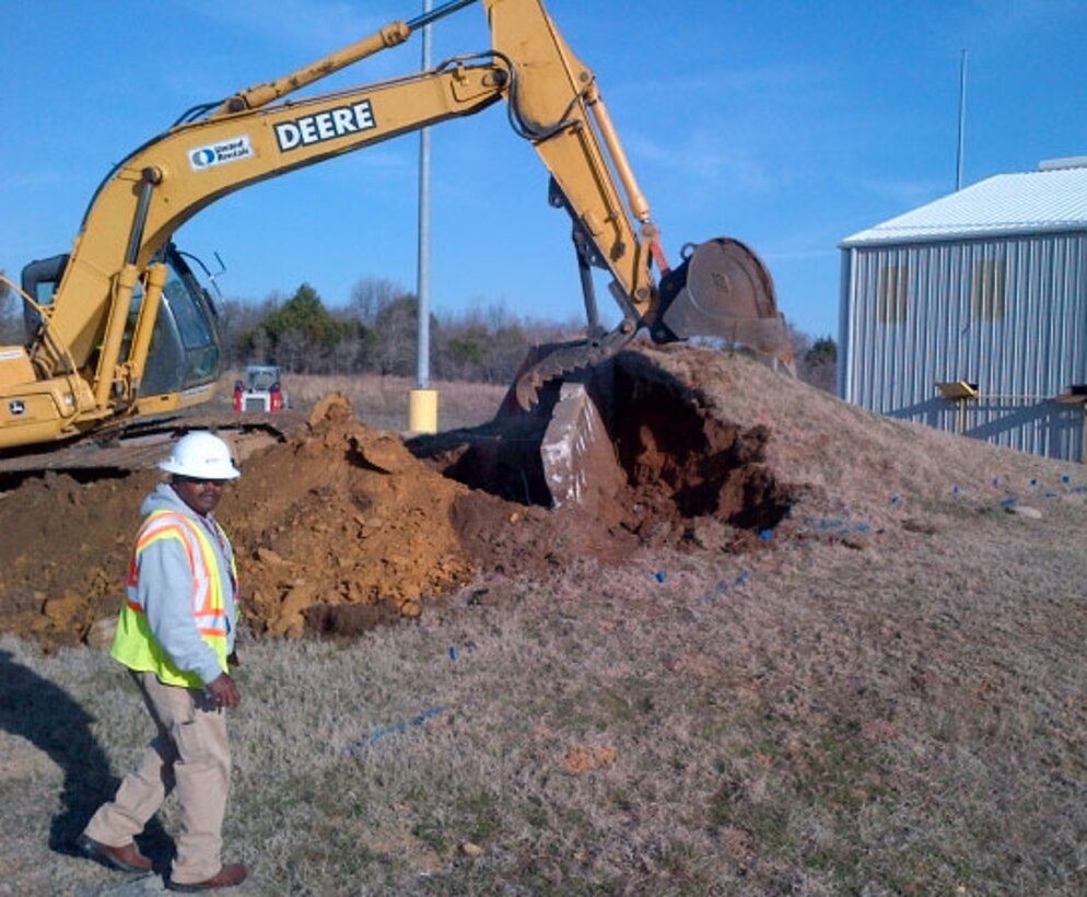 Workers remove an underground safety shelter at McAlester Army Ammunition Plant, Okla. The Center’s Facility Reduction Program manages the project.