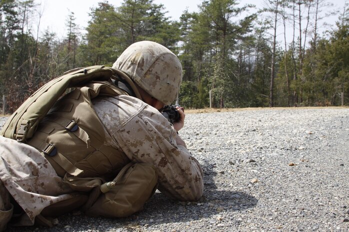 A Marine from Marine Wing Support Squadron 171 provides security as his fellow Marines search for an improvised explosive device during an afternoon convoy patrol in the Haramura training area as part of Exercise Thunder Horse, March 19, 2013. The convoys tasked Marines in dealing with certain scenarios replicating possible situations encountered in Afghanistan.