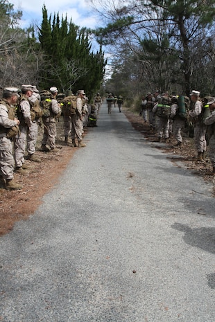Marines with Combat Engineers, Marine Wing Support Squadron 171, hike through the mountain
passes of Haramura near the site of Exercise Thunder Horse, March 21, 2013. Throughout the hike, Marines would check the Marine in front of them to make sure their equipment was not falling off or loose.