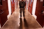 A Soldier stands guard on a cell block inside Camp Five at the Joint Task Force Guantanamo detention center at Naval Base Guantanamo Bay, Cuba, Nov. 14, 2006. Camp Five is one of six camps that comprise the dentention center, and has been built with many features that can be found in many maximum security prisons in the United States. Camp Five is where the most non-compliant and hostile detainees are held. ( Photo by                                                           