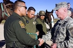 Lt. Gen. H Steven Blum, chief, National Guard Bureau, talks with Border Patrol agents during a visit to the U.S. border with Mexico near Columbus, N.M., on Nov. 29, 2006. Up to 6,000 National Guard troops are helping the Border Patrol secure the nation's southern border in Operation Jump Start.