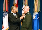 Donald Rumsfeld awards the Defense Distinguished Service Medal to LTG H Steven Blum, chief of the National Guard Bureau, at the Pentagon Dec. 13 during Rumsfeld's final week as secretary of defense. Rumsfeld paid tribute to the National Guard's overwhelming response to Hurricane Katrina in September 2005.