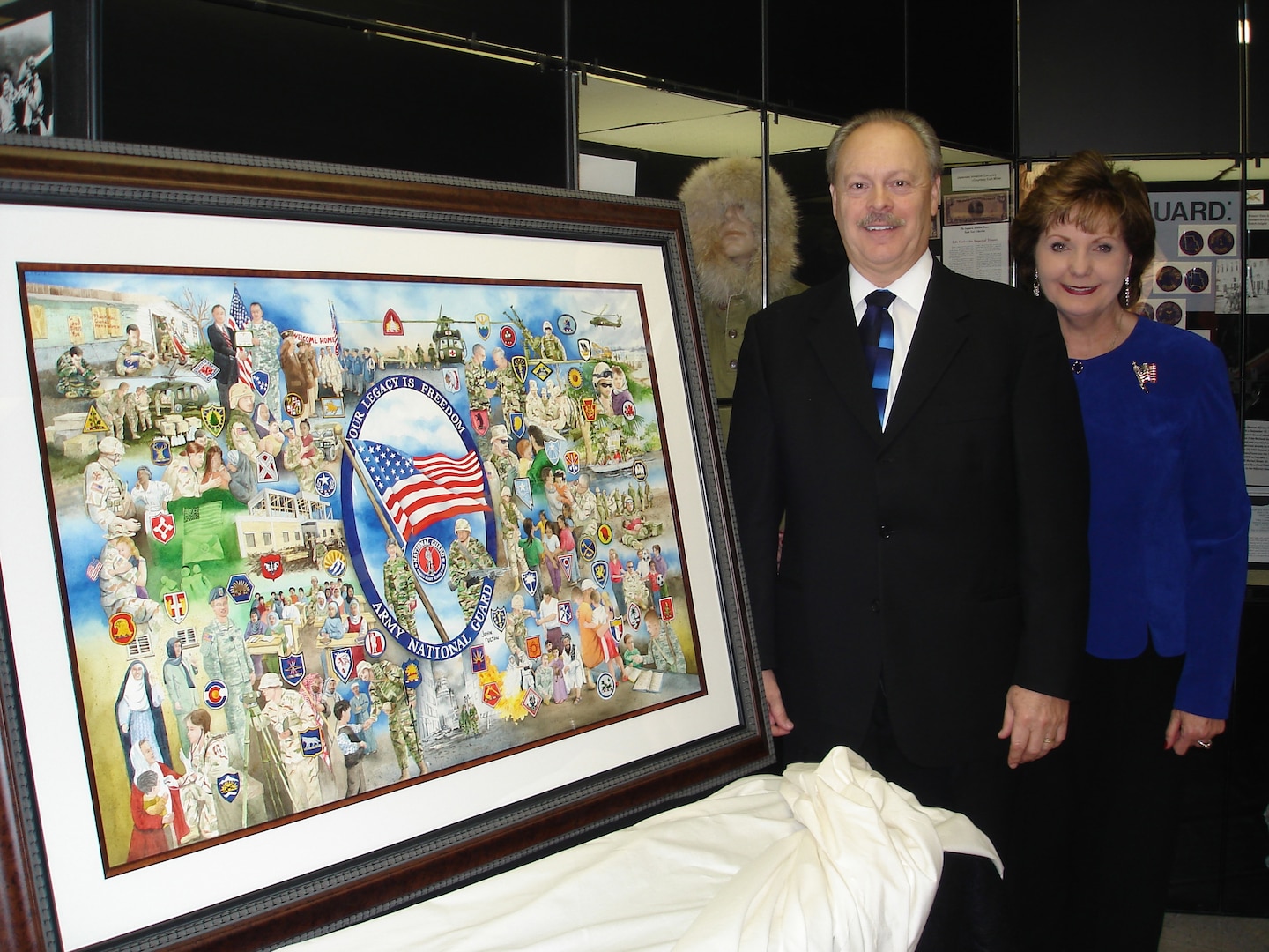 Springfield, Mo., artist John Fulton and his wife Billie display "Our Legacy is Freedom", a watercolor they created to honor the men and women of the Army National Guard and their families.
