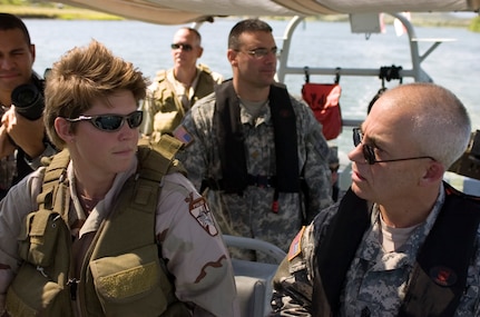 Command Sgt. Maj. David Hudson, right, the senior enlisted advisor to LTG H Steven Blum, the chief of the National Guard Bureau, talks with a Coast Guard member during a visit to National Guard troops deployed to Joint Task Force-Guantanamo on Nov. 15, 2006.