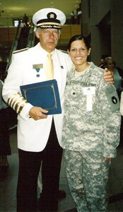 Army SPC. Jessica Gaulke poses with Ted Zwieg, commodore of the Minneapolis Aquatennial, during her candidacy for 2007 Aquatennial Queen of the Lakes.