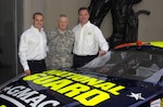 Casey Mears, the National Guard's new Guard Car Driver, poses with Lt. Gen. Clyde A. Vaughn, the director of the Army National Guard, and Lance McGrew, crew chief, at the Army National Guard Readiness Center, Arlington Hall, on Jan. 12, 2007. Mears will drive the new #25 National Guard GMAC Chevy Monte Carlo SS with Hendrick Motorsports in this year's NASCAR Nextel Cup series.