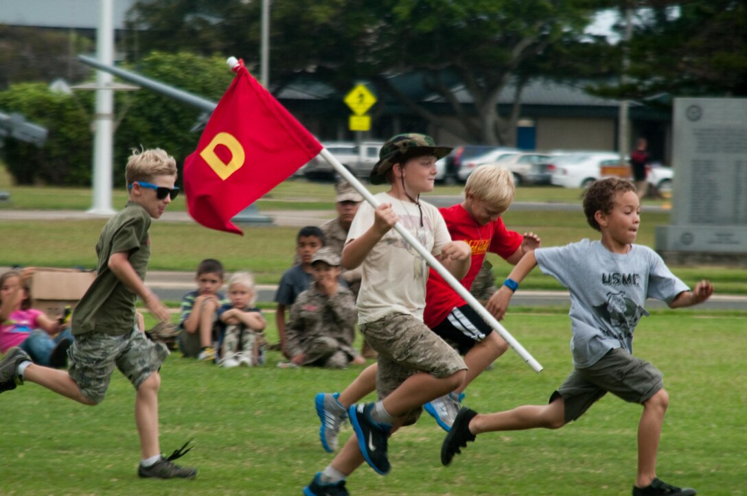 MARINE CORPS BASE HAWAII - Members of Delta Company run to their volunteer drill instructors for the final drill team competition held at Dewey Square during Operation Ooh-rah Kids, March 22, 2013. Participants learned about proper etiquette and courtesies for deployed Marines and sailors during the event. (U.S. Marine Corps photo by Christine Cabalo)


