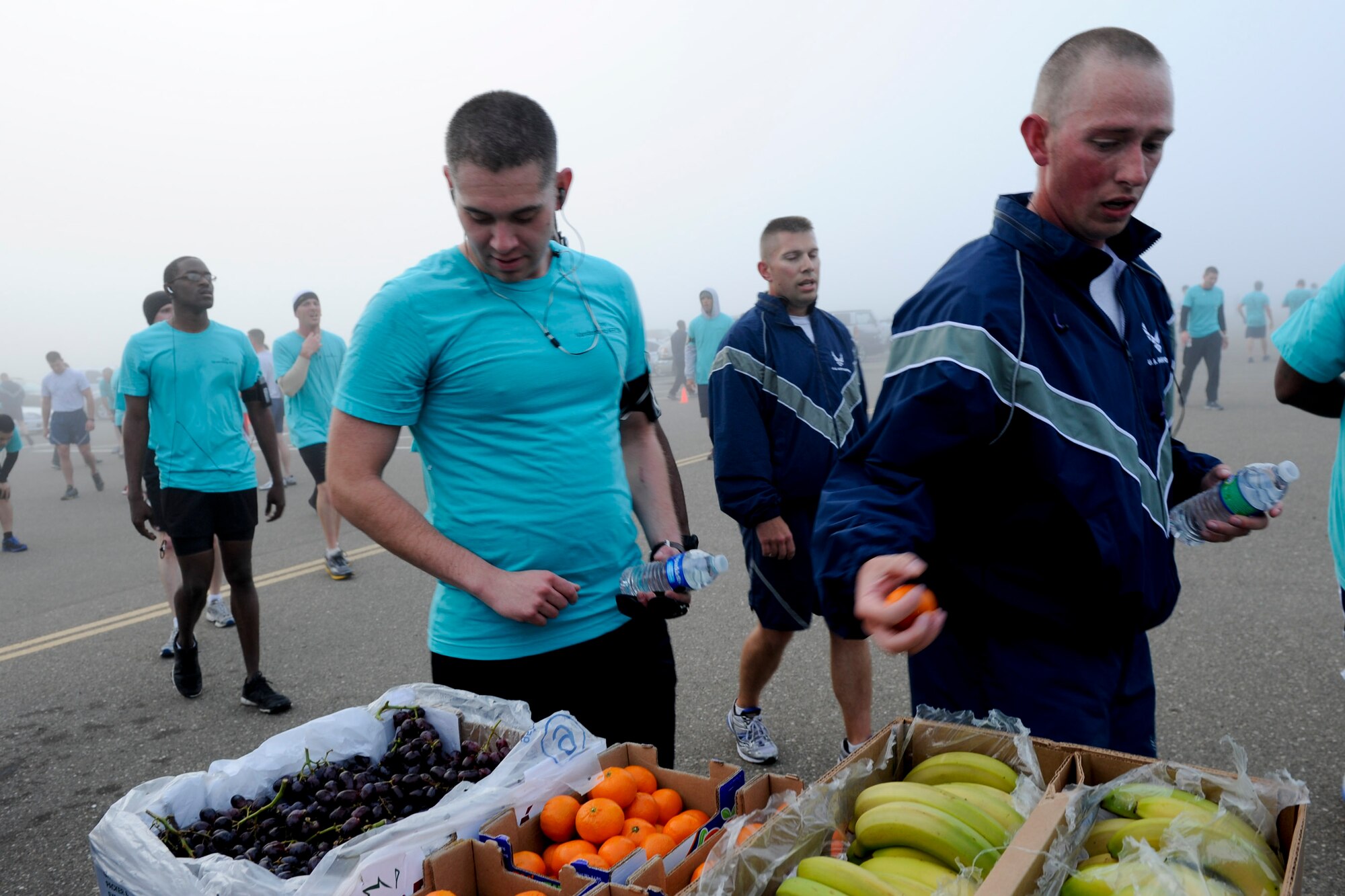 VANDENBERG AIR FORCE BASE, Calif. -- Team V members grab fruit during the monthly Fit-to-Fight Run here Friday, March 29, 2013. Runners were encouraged to wear blue and teal T-shirts, representing Child Abuse Awareness Month and Sexual Assault Awareness Month respectively. (U.S. Air Force photo/Staff Sgt. Levi Riendeau)
