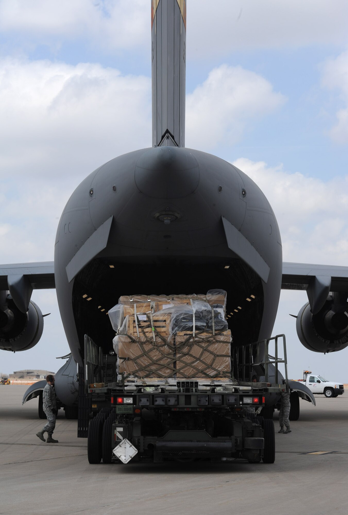 Nearly five-tons of surplus firefighting equipment is loaded on to a C-17 Globemaster III assigned to March Air Reserve Base, Calif., March 29, 2013, McConnell Air Force Base, Kan. At least once a year, the 22nd Logistics Readiness Squadron Airmen assist with humanitarian shipments to countries around the world. (U.S. Air Force photo/Senior Airman Laura L. Valentine)