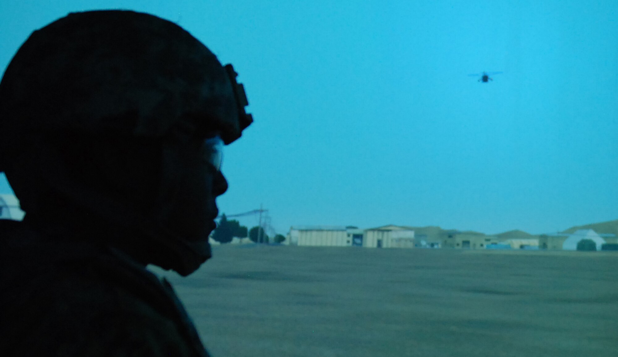 Army Capt. Jay Turner, a supply corps officer with Defense Logistics Agency, from Columbia, Md., pulls security while training in the Reconfigurable Vehicle Tactical Trainer March 13, 2013, in the National Guard Bureau Joint Training and Training Development Center at Joint Base McGuire-Dix-Lakehurst, N.J. A medical evacuation helicopter takes wounded personnel to a care facility as programmed for the simulation. (U.S. Army photo by Sgt. Anita VanderMolen/Released)
