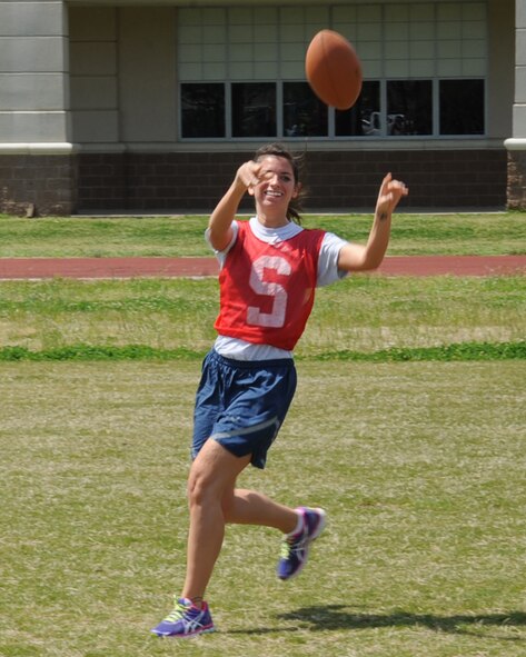 An Airman from the 26th Operational Weather Squadron, catches a ball during a game of ultimate football at the Bryan Bell Fitness Center on Barksdale Air Force Base, La., March 29. The fitness center offers a variety of sports equipment for Team Barksdale to play including basketball, volleyball, racquetball, football and soccer. (U.S. Air Force photo/Senior Airman Sean Martin)