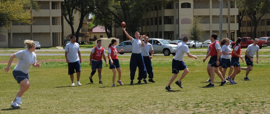 Airmen from the 26th Operational Weather Squadron play a game of ultimate football at the Bryan Bell Fitness Center on Barksdale Air Force Base, La., March 29. The fitness center has an indoor and outdoor running track, a cardio and weight room, and basketball and racquetball courts available to Barksdale personnel. (U.S. Air Force photo/Senior Airman Sean Martin)