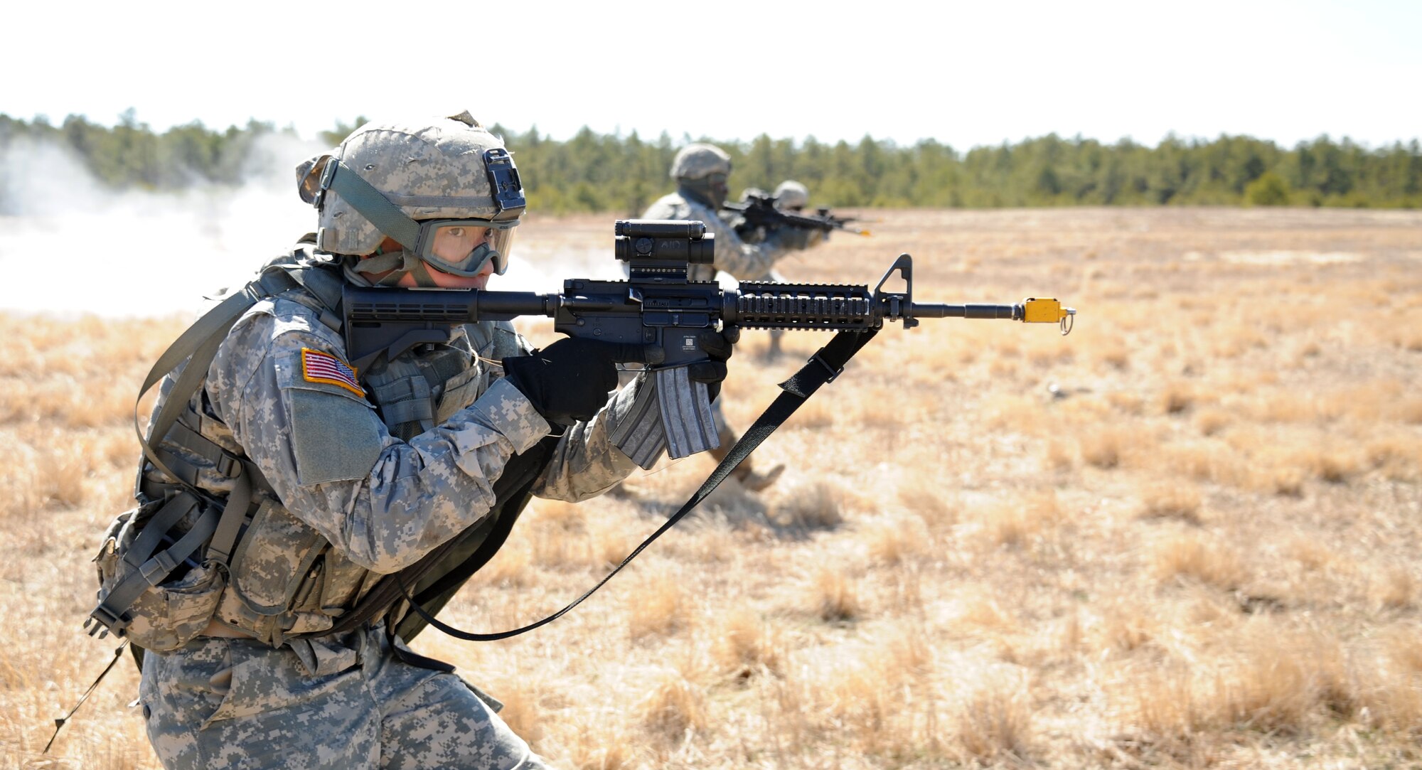 New Jersey National Guard Pfc. Daniel Sung, 2nd Battalion, 113th Infantry Regiment, infantryman, rushes with his squad while carrying an M4 rifle during a squad live-fire exercise on Range 61 March 23, 2013, at Joint Base McGuire-Dix-Lakehurst, N.J. Sung, a Hasbrouck, N.J., native, acted as a rifleman in the squad and provided the maneuver element. The unit is based out of Riverdale, N.J. (U.S. Air Force photo by 2nd Lt. David J. Murphy/Released)