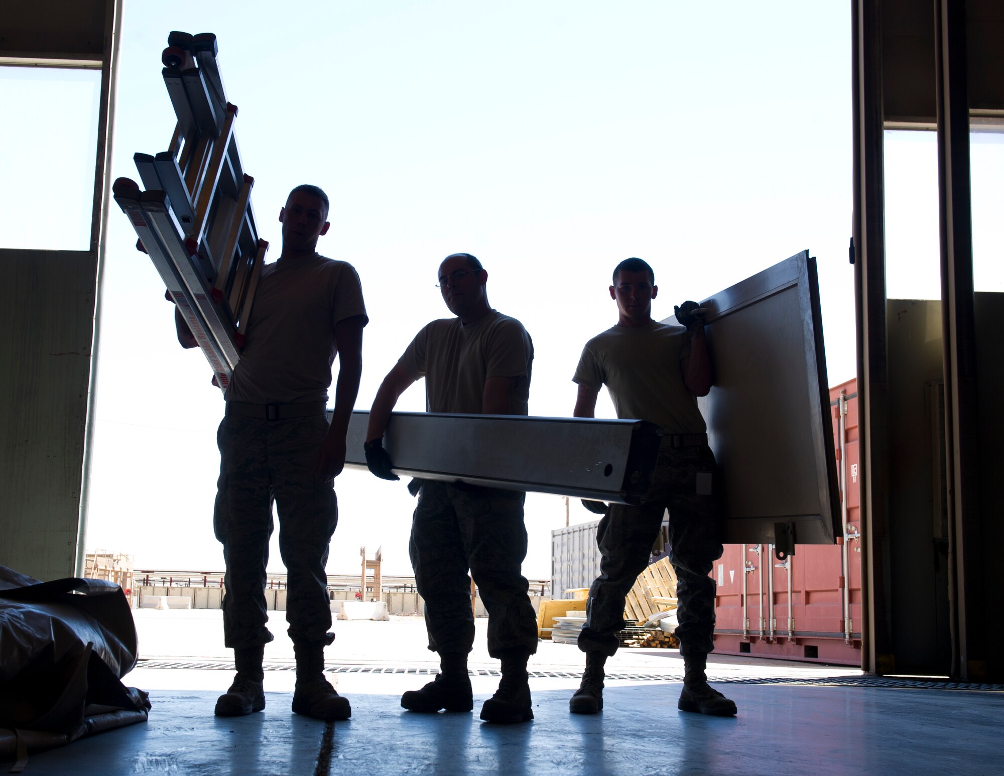 HOLLOMAN AIR FORCE BASE, N.M. – Senior Airman Chris Warchol, Staff Sgt. George Fritz and Airman 1st Class Bryan Haley, all from the 49th Materiel Maintenance Group structural shop, pose for a photo April 4, 2012. The 49th MMG, more commonly known as Basic Expeditionary Airfield Resources, provides deployable assets anywhere in the world. The 49th MMG accomplishes this mission by sending large, all-inclusive packaged equipment to deployed locations or to areas impacted by natural disasters. (U.S. Air Force photo by Airman 1st Class Michael Shoemaker/Released)